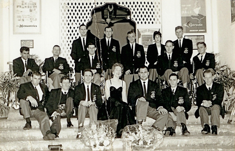 Members of the Australian Paralympic Team pose with an entertainer from the hotel where they stayed in Singapore en route to the 1960 Rome Paralympic Games.